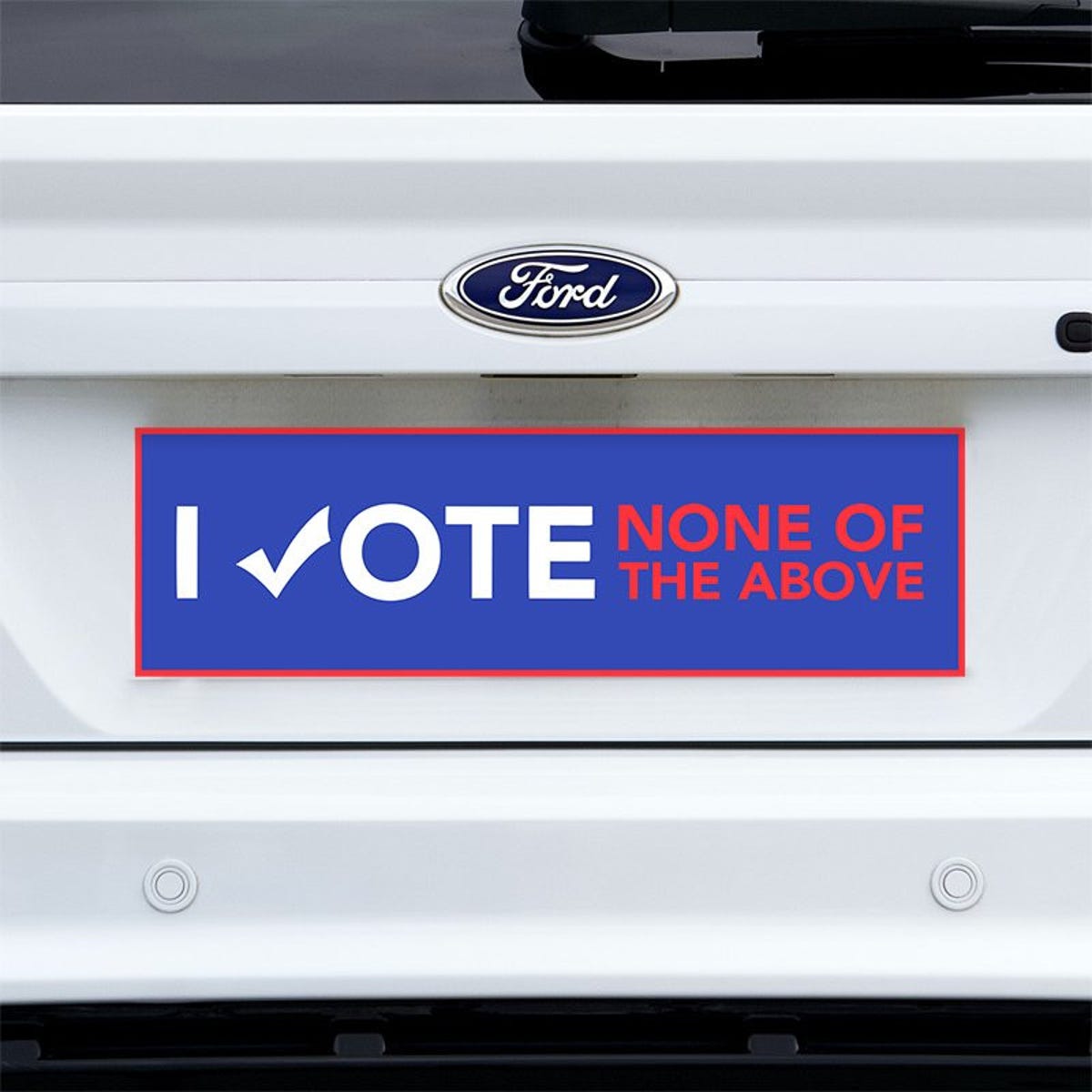 None of the Above Political Bumper Sticker on a white truck
