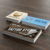 Three stacks of custom vinyl stickers with varying business designs
