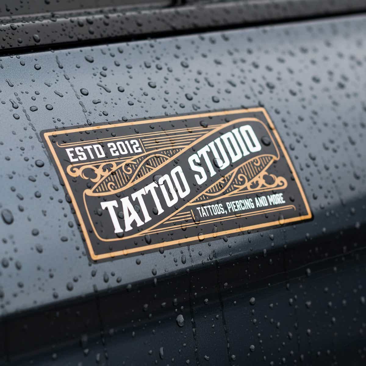 A custom horizontal vinyl sticker for a tattoo shop