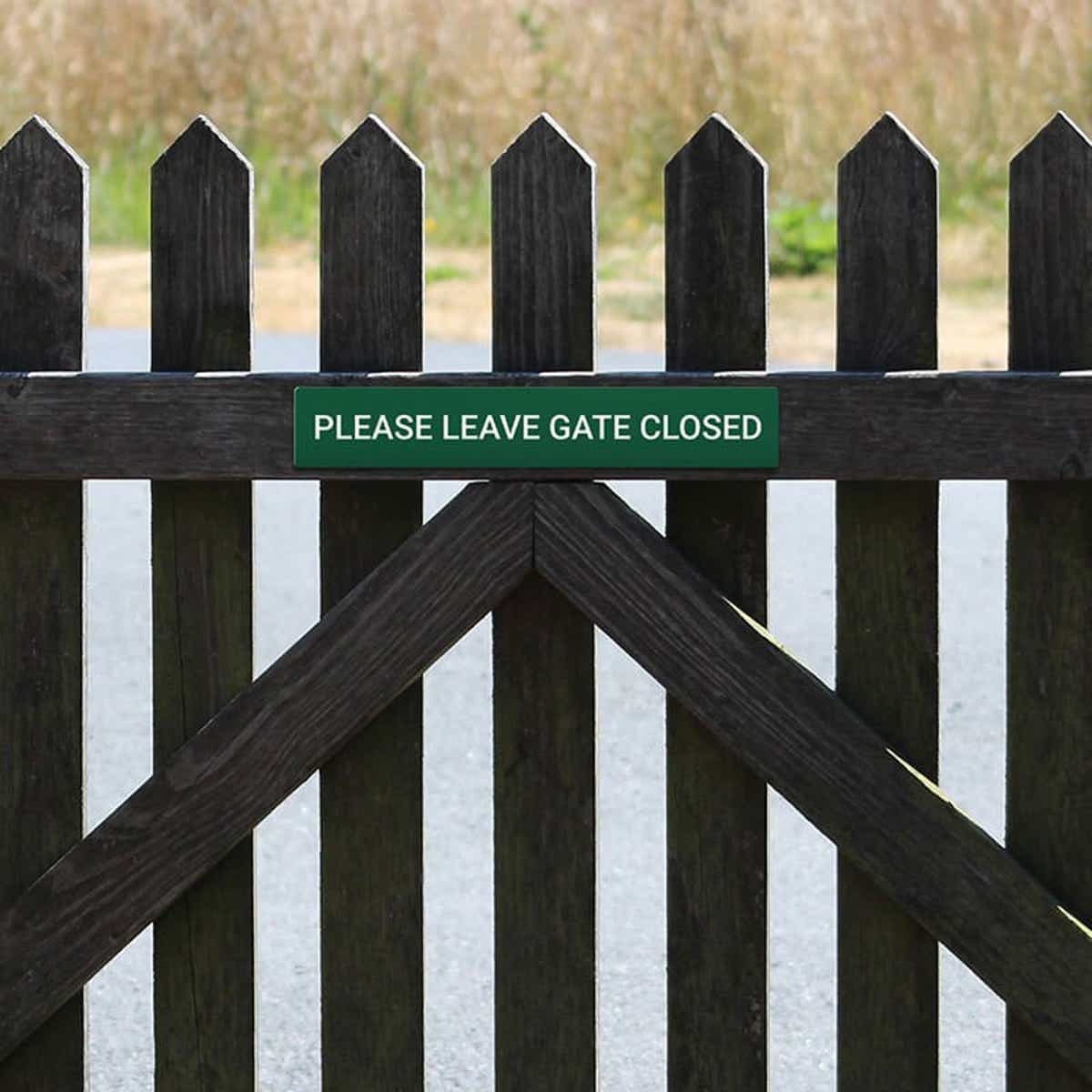 Engraved Sign Horizontal 3" x 18" on a gate