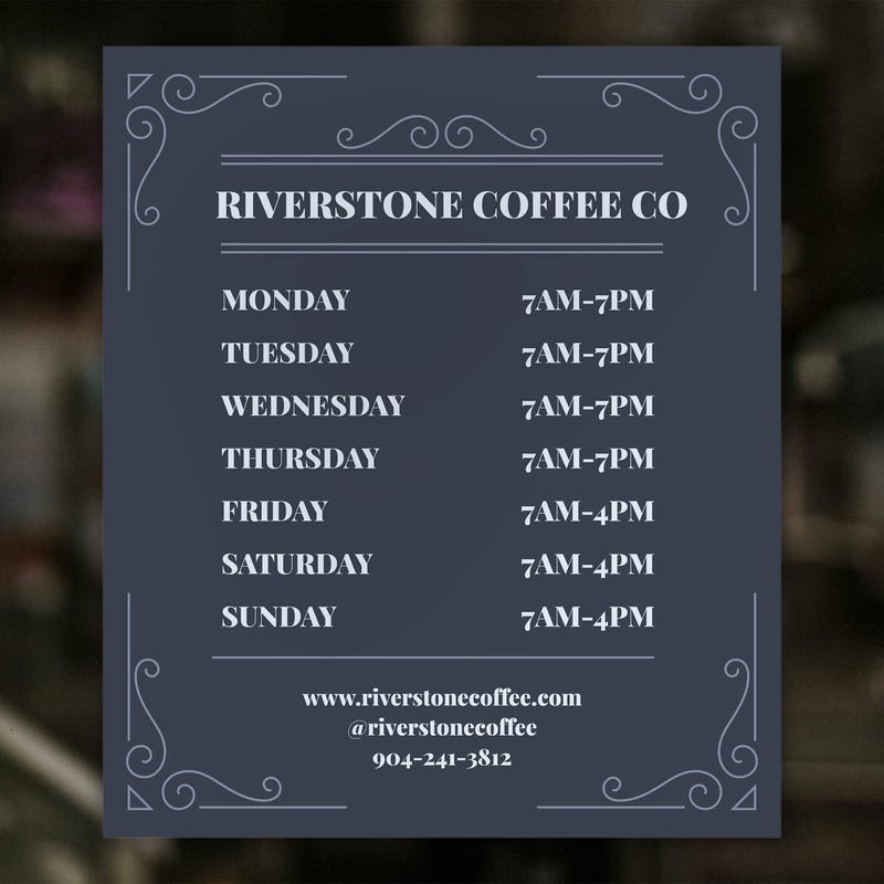 The modern business hour sign on a window for a coffee shop