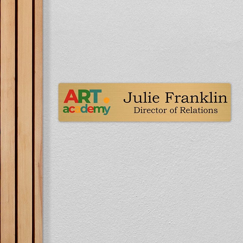 4x18 printed brass sign displayed by a doorway