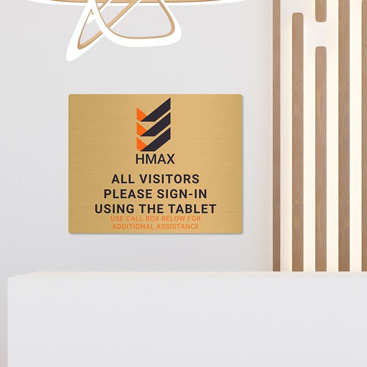 8x10 printed brass sign displayed in a waiting room