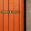 1" x 8" custom plastic sign displayed on a wooden wall