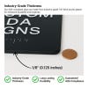The 1/8th-inch thickness of the ADA sign compared to a penny