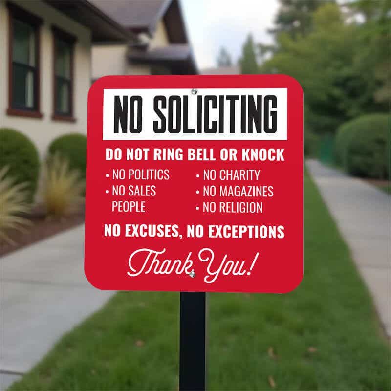 Red No soliciting  yard sign in bold text. Do not ring bell or knock. No excuses, No exceptions, thank you in white text