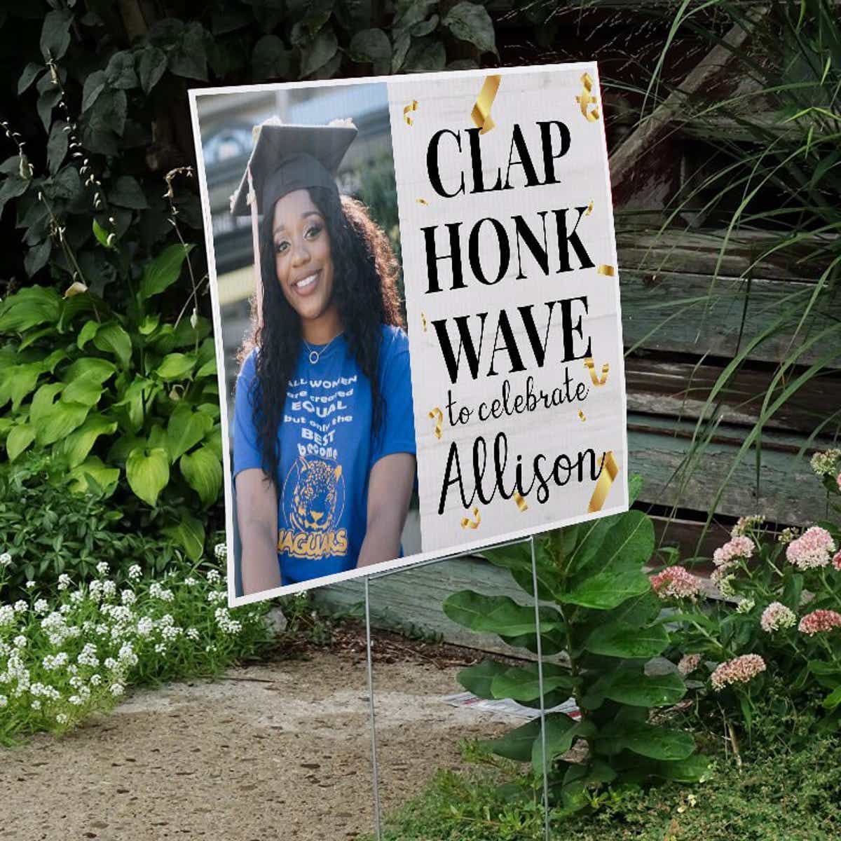 Clap, Honk, Wave Graduation Yard Sign Next to Stairs