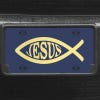 A close up of the Jesus Fish Ichthys front license plate on a black car