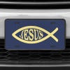 A close up of the Jesus Fish Ichthys front license plate on a white car