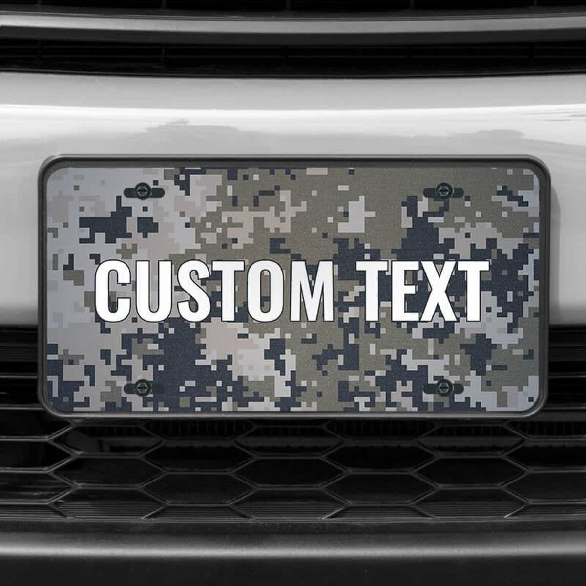 A close up of the Custom Military Camo front license plate on a white car