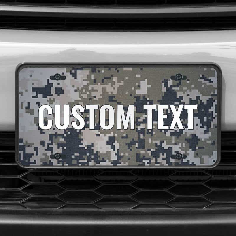 A close up of the Custom Military Camo front license plate on a white car
