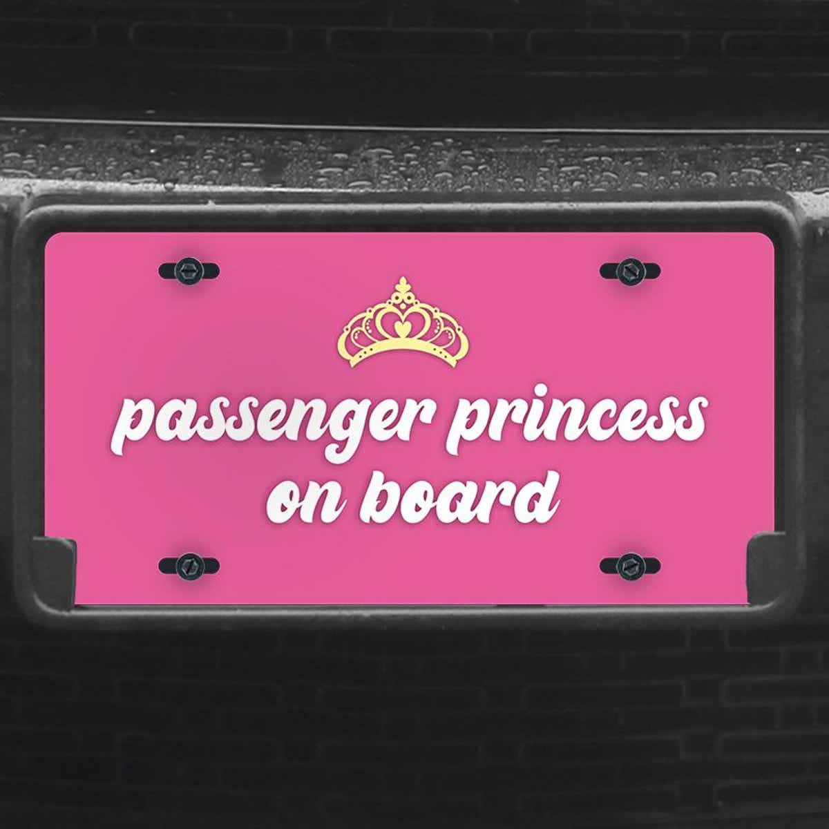 A close up of the Passenger Princess front license plate on a black car