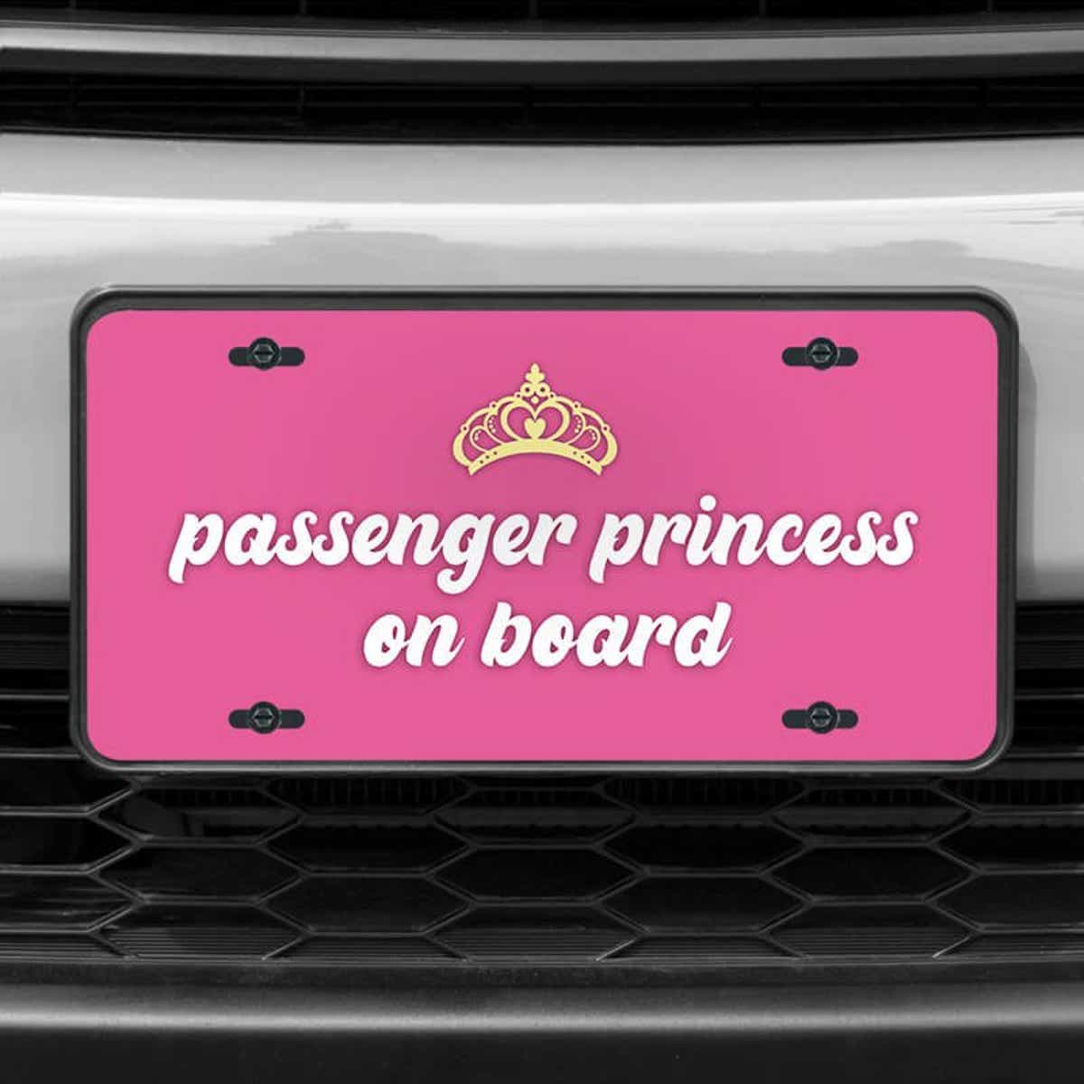 A close up of the Passenger Princess front license plate on a white car