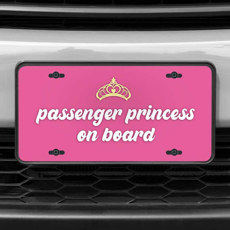A close up of the Passenger Princess front license plate on a white car