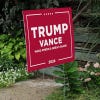 Trump Vance Red Yard Sign next to stairs