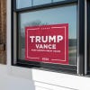 Trump Vance Red Yard Sign in a window