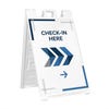 A custom sandwich board sign with an arrow directing to a check-in