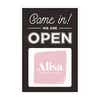 A sandwich board sign for a boutique that says We Are Open and features their logo