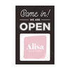A sandwich board sign for a boutique that says We Are Open and features their logo