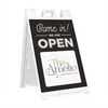 A We Are Open sandwich board sign for a coffee and tea shop