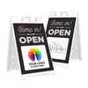 Two examples of the We Are Open sandwich board sign with an uploaded logo