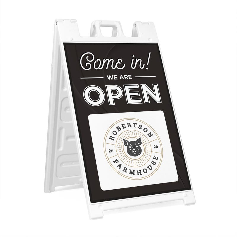A sandwich board sign for a farmhouse that says We Are Open and features their logo