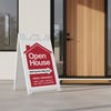 An open house sandwich board sign featuring a newly renovated message
