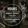 Custom Business Hour Sign with Floral Design displayed on a window