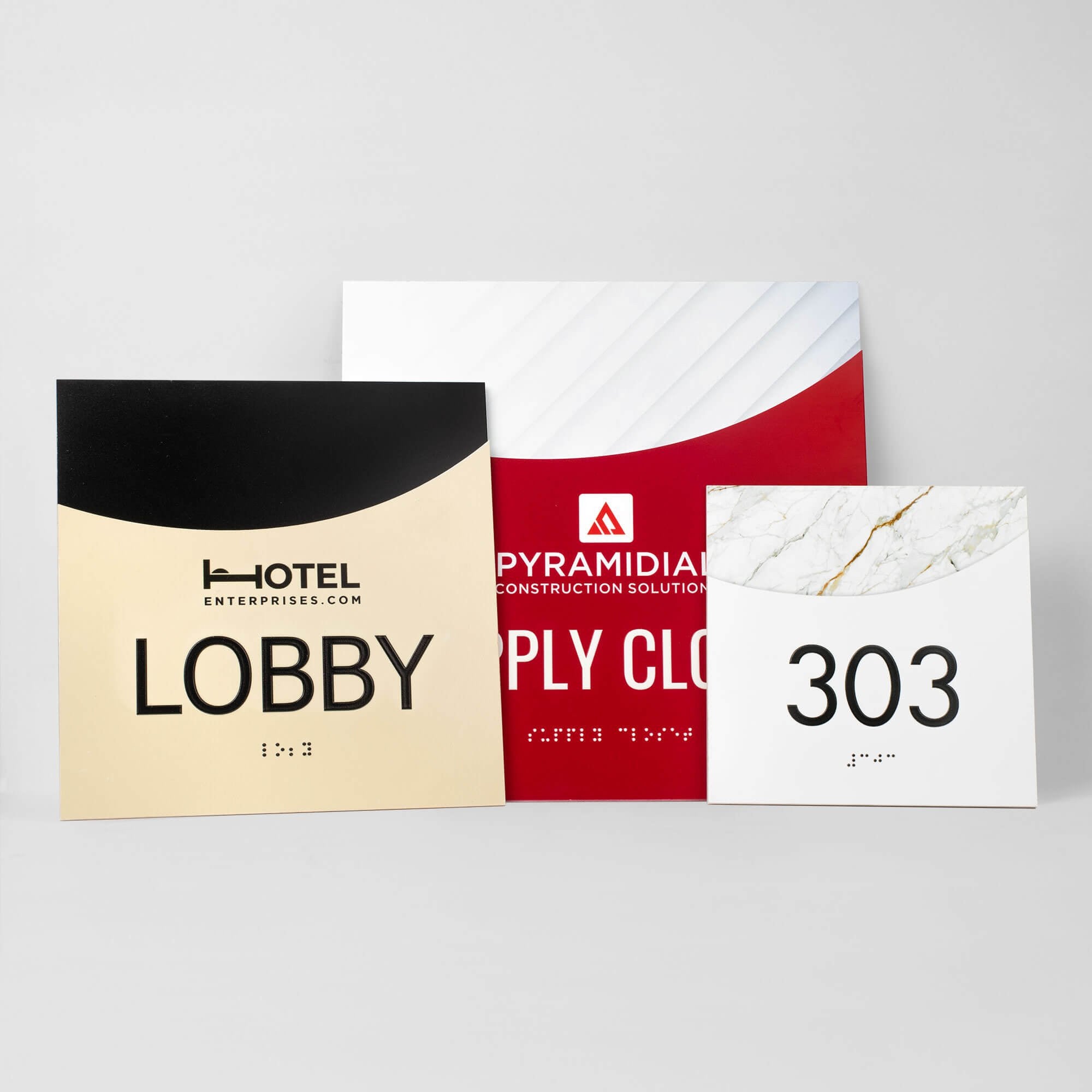 Three different sizes and designs of the modern arch 2-layered ADA sign