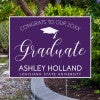 Congrats to our graduate yard sign displayed next to pavement