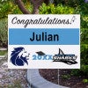 Double Logo Graduation Yard Sign Next to Pavement