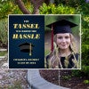 Tassel was worth the hassle graduation yard sign displayed next to pavement