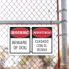 Bilingual Beware of Dog Aluminum Sign | 12" x 18" Lifestyle Photo Outside