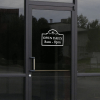 Open Daily Business Hours Die Cut Decal on a storefront window