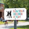 Custom traffic safety sign with a child icon that reads in colorful text: Slow Down Children At Play!