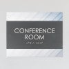 A design example of the horizontal 2-layer ADA sign for a conference room with a gray foreground and minimal diagonal background