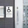 A white ADA sign for a handicap accessible entrance