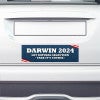 Darwin Political Bumper Sticker on the bumper of a white car
