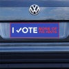 None of the Above Political Bumper Sticker on a gray car