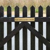 2x12 custom engraved brass sign on a fence