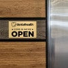 6x10 custom engraved brass sign displayed on a wall