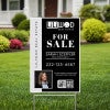 An 18x12 vertical yard sign for a realtor in a yard