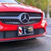 American Flag and Eagle front license plate on a red car