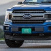 Probably Late front license plate on a blue truck