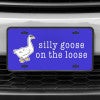 A close up of the Silly Goose front license plate on a white car