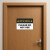 Out of Service Sign on a wooden door
