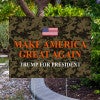 Camo MAGA Trump Yard Sign Next to Pavement