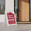 An open house sandwich board sign featuring a newly renovated message