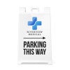The Parking This Way sandwich board sign with an arrow and a medical logo