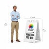 A 67-inch tall man standing next to the 45-inch tall A-frame to show the height comparison